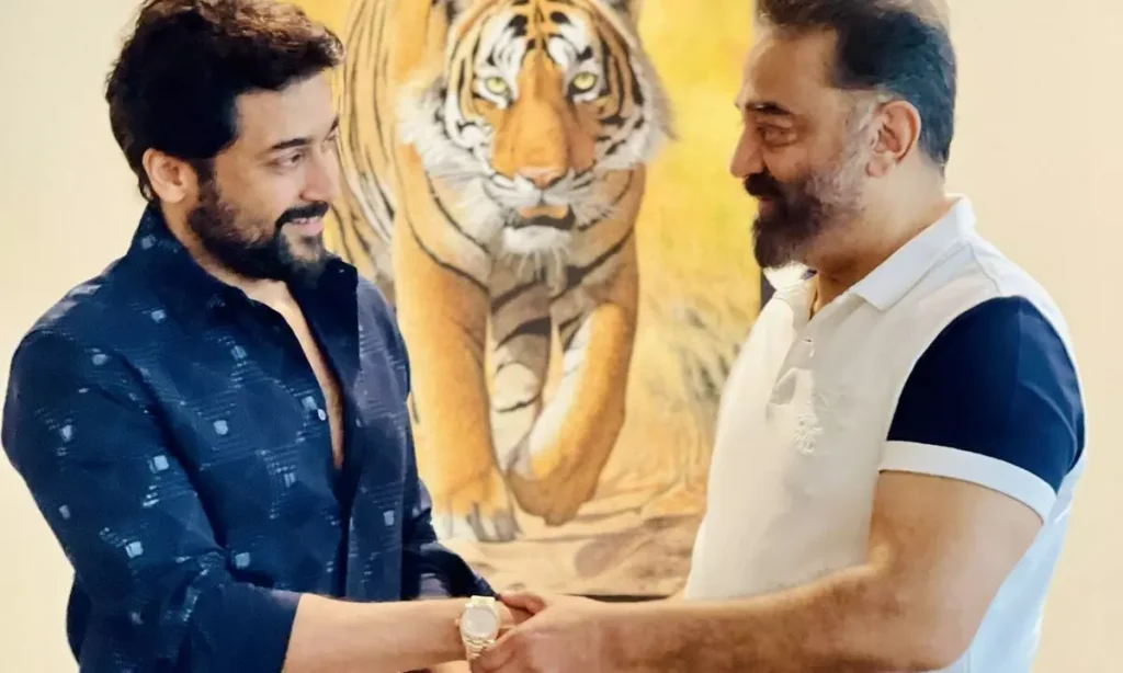 Kamal gifting a Rolex watch to Suriya