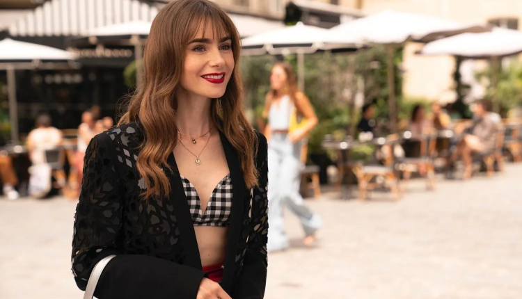 Gingham-printed monochrome bralette, a sheer blazer shrug, as well as red bottoms