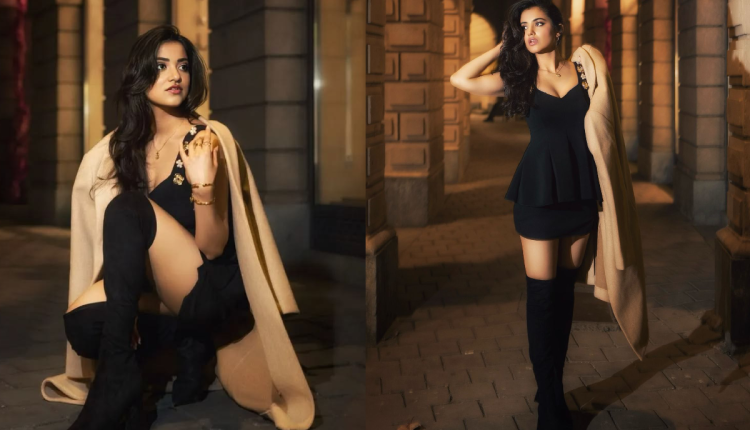 black mini dress with over-the-knee boots